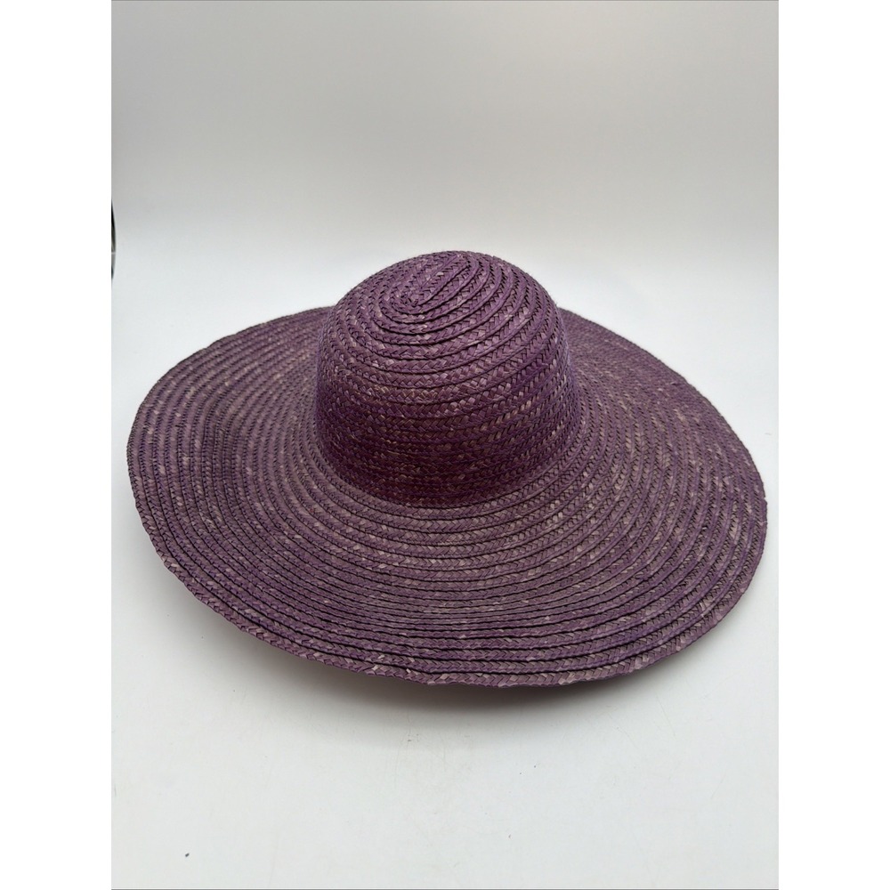 purple woven straw sun hat featuring a rounded spiral crown